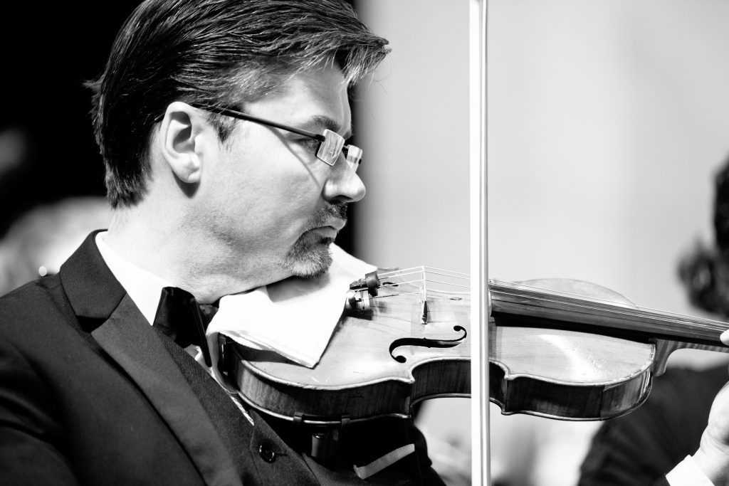 Violinist Michael Sutton plays in this black and white photograph