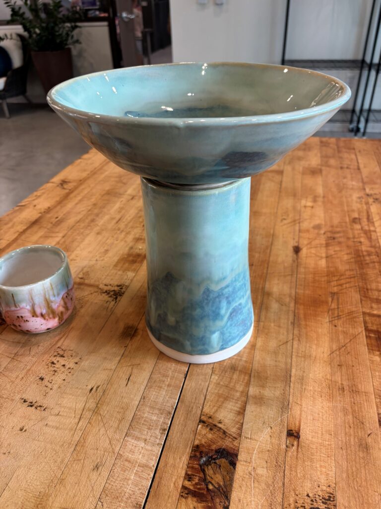 A wide bowl on a narrow stand